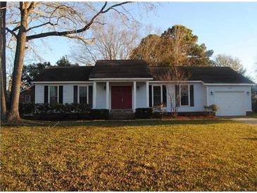 Charming single-story home featuring a well-maintained lawn and attached garage at 1111 Kilarney Rd, Mount Pleasant, SC 29464