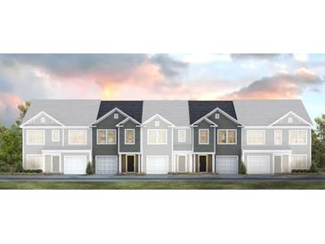 A modern townhome with neutral siding, a one-car garage, and simple landscaping at 137 Yarrow Way, Moncks Corner, SC 29461