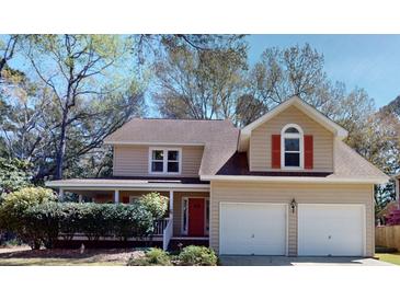 Charming two-story home with attached two-car garage and inviting front porch at 2071 Middleburg Ln, Mount Pleasant, SC 29464