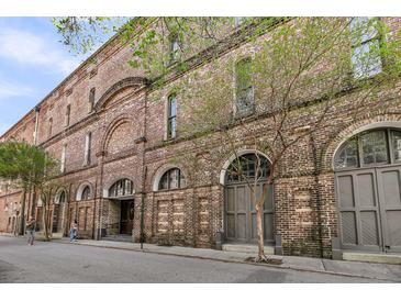 Stunning brick apartment building with arched windows and street-side appeal at 3 Queen St # 315, Charleston, SC 29401
