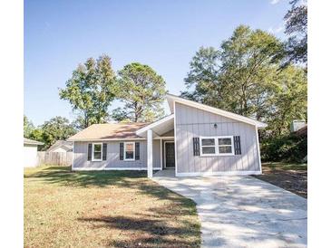 Charming single-story home with a well-manicured lawn and inviting curb appeal at 780 Corral Dr, Charleston, SC 29414
