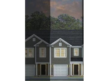 Charming two-story townhomes offer modern design, attached garages and well-lit exteriors at 139 Yarrow Way, Moncks Corner, SC 29461