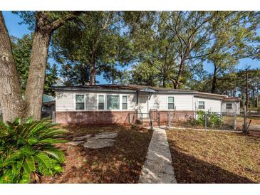 Charming single-story home featuring a brick foundation and a well-manicured front yard at 20 Stratton Dr, Charleston, SC 29420