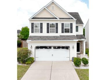 Charming two-story home with a two-car garage and manicured landscaping at 243 Longford Dr, Summerville, SC 29483
