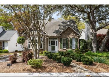 Charming brick home with green shutters and a well-manicured front yard at 956 Provincial Cir, Mount Pleasant, SC 29464