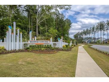 Welcome to Homecoming: picturesque community entrance with attractive landscaping and sidewalk at 1014 Marsh Harrier Dr # Cc3-1-5, Ravenel, SC 29470