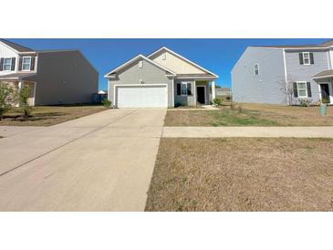 Charming single Gathering home with attached garage and well-manicured lawn at 434 Pender Woods Dr, Summerville, SC 29486