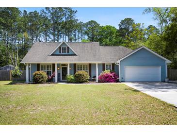 Charming single-story home featuring a well-manicured lawn and beautiful landscaping in a desirable location at 4429 Highway 162, Hollywood, SC 29449