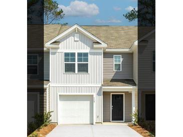 Charming two-story home features a light gray exterior, a single-car garage and a concrete driveway at 122 Haventree Ct, Summerville, SC 29486