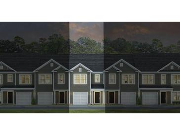 Charming new townhomes feature attached garages and inviting architectural details at 136 Haventree Ct, Summerville, SC 29486