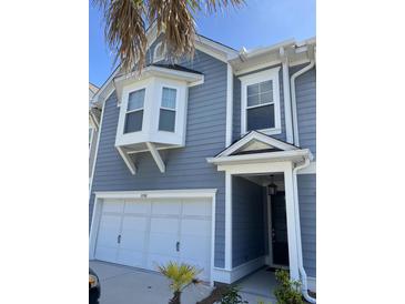 Charming two-story home with a one-car garage, bay window, and stylish entrance at 2338 Kings Gate Ln, Mount Pleasant, SC 29466
