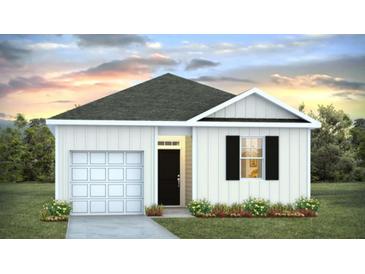 Charming single-story home featuring white siding, a gray roof, and an attached garage, set against a beautiful sky at sunset at 7027 Deanston Dr, Ravenel, SC 29470