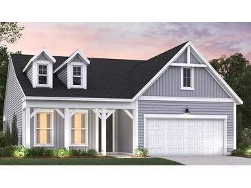 Charming single-Gathering home featuring gray siding, dormer windows, and a two-car garage at 1000 Winding Grove Ln, Moncks Corner, SC 29461