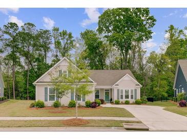 Charming single-story home with a well-manicured lawn and inviting curb appeal, enhanced by blue shutters at 1160 Old Field Dr, Summerville, SC 29483
