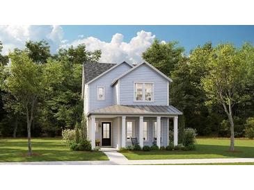 Charming two-story home with light blue siding, covered front porch, and well-manicured lawn at 1431 Clay Field Trl, Summerville, SC 29485