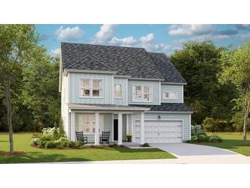Charming two-story home with a covered porch, light-blue siding and a well-manicured lawn and landscaping at 147 Threaded Fern St, Summerville, SC 29485