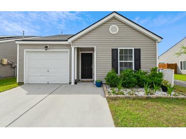 Charming single-story home with a one-car garage and landscaped front yard at 161 Brittondale Rd, Summerville, SC 29485