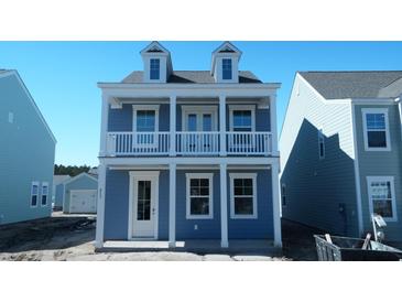 Charming two-story home featuring a balcony and a light blue exterior at 213 Terrace View Dr, Summerville, SC 29486