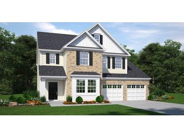 Charming two-story home with brick and siding, attached garage, and manicured front lawn at 261 Camellia Bloom Dr, Moncks Corner, SC 29461