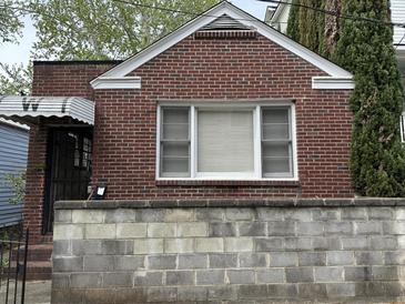 Charming brick facade with a window on a lovely classic home at 3 Woodall Ct, Charleston, SC 29403
