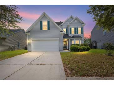 Charming two-story home featuring a two-car garage and well-maintained landscaping in the front yard at 5224 Stonewall Dr, Summerville, SC 29485