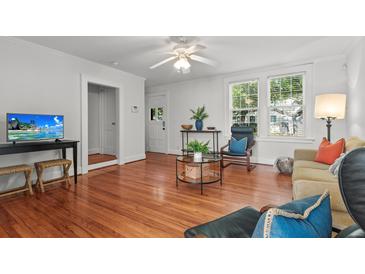 Bright living room with hardwood floors and modern furnishings, perfect for relaxing or entertaining at 17 8Th Ave # 17G, Charleston, SC 29403