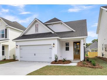 Charming home showcasing a one-car garage, neat landscaping, and attractive architectural details at 316 Abercom Place Dr, Moncks Corner, SC 29461