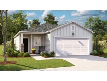 Charming single-story home with a two-car garage, well-manicured lawn, and inviting curb appeal at 319 Tiliwa Street, Summerville, SC 29486