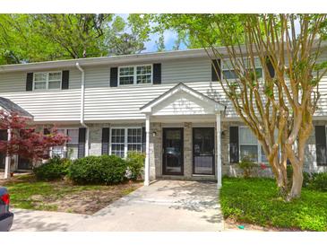 Charming townhome featuring classic siding, dark shutters, and a welcoming entrance at 507 Stinson Dr # 7F, Charleston, SC 29407