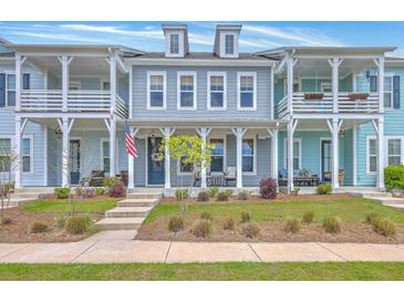 Charming townhomes boast double porches, inviting curb appeal, and classic architectural details at 3119 Sturbridge Rd, Mount Pleasant, SC 29466