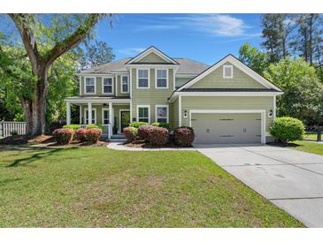 Charming two-story home with well-manicured lawn and mature trees at 106 Abigale Ln, Summerville, SC 29483
