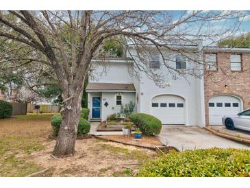Charming two-story home with a well-manicured lawn and attached garage at 29 Meander Row, Charleston, SC 29412