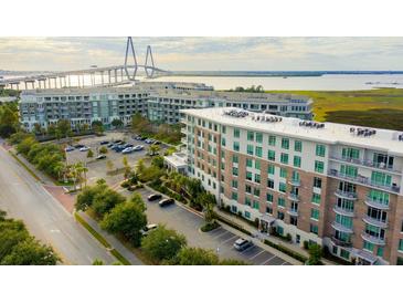 Stunning aerial view of the apartments showcasing its waterfront view and the Ravenel Bridge in the background at 155 Wingo Way # 433, Mount Pleasant, SC 29464