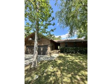 Charming home with a two-car garage and a yard with mature trees at 1805 Wood Duck Rd, Moncks Corner, SC 29461