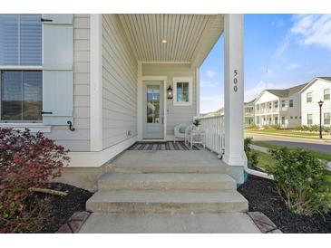 Inviting front porch with a chair and decorative welcome mat to greet guests at 500 W Respite Ln, Summerville, SC 29483