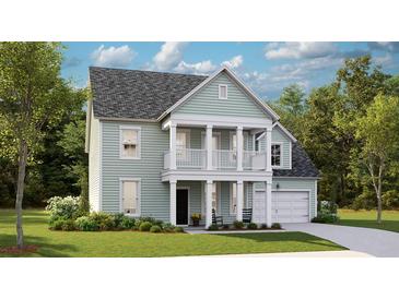 Charming two-story home with a welcoming front porch, lush green lawn, and attached garage at 553 Richfield Way, Summerville, SC 29486
