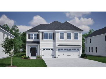 Charming two-story home with a three-car garage, well-maintained lawn and attractive curb appeal at 139 Seaton St, Summerville, SC 29486