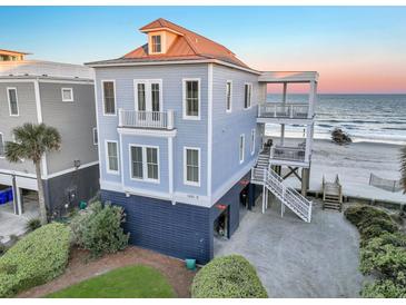 Beautiful oceanfront home featuring multiple decks, beach access, and spacious outdoor living at 1681 E Ashley Ave # B, Folly Beach, SC 29439