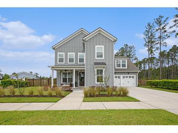 Charming two-story home with gray siding, white trim, and a welcoming front porch and a two-car garage at 200 Clearblue Loop, Summerville, SC 29486