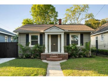 Charming home with landscaped front yard, brick entryway, and inviting front door at 40 Dunnemann Ave, Charleston, SC 29403
