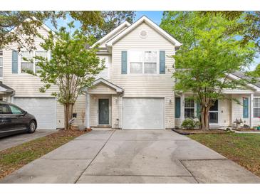 Charming townhome with attached garage, well-manicured lawn and inviting curb appeal at 7873 Park Gate Dr, North Charleston, SC 29418