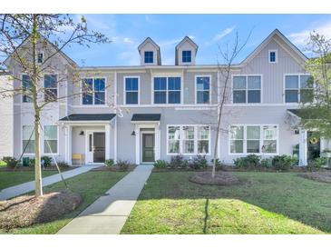 Charming townhome with classic architecture and a well-maintained lawn at 131 Brown Swiss Cir, Summerville, SC 29483