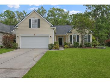 Charming single-Gathering home with a well-manicured lawn and attached two-car garage at 1726 Waterbrook Dr, Charleston, SC 29414