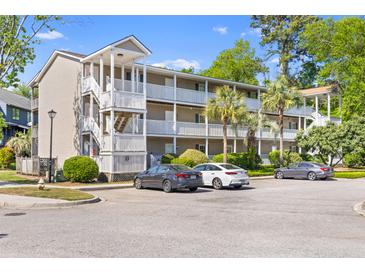 Attractive apartment complex with multiple levels and white balconies and stairs in a nice landscaped community at 1530 Fort Johnson Rd # 3C, Charleston, SC 29412