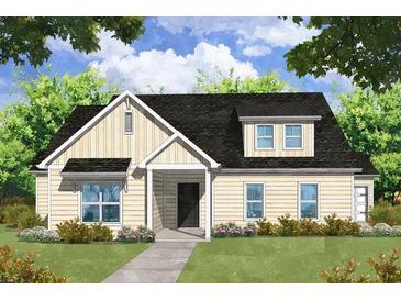 Charming one-story home with a covered porch and well-manicured lawn surrounded by lush trees at 1968 Central Ave, Summerville, SC 29483