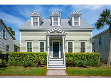 Charming two-story home with a well-manicured lawn and beautiful landscaping at 41 Jane Jacobs St, Mount Pleasant, SC 29464