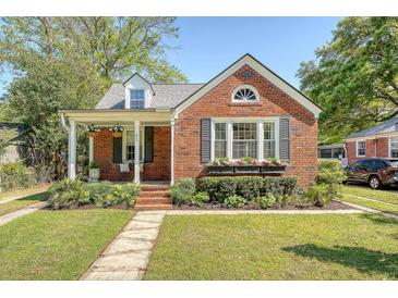 Charming brick home with a landscaped front yard and inviting porch at 45 Lyttleton Ave, Charleston, SC 29407