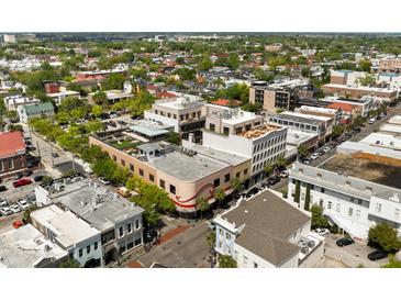 A vibrant aerial view of a charming commercial building with roof top patios and downtown surrounding in Charleston, SC at 517 King St # 1, Charleston, SC 29403