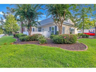 Charming two-story home featuring manicured landscaping, mature trees and inviting curb appeal at 8800 Dorchester Rd # 2902, North Charleston, SC 29420