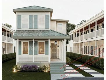 Charming two-story home featuring a welcoming front porch and beautifully landscaped front yard at 8 Homel Pl, Charleston, SC 29403